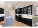 Modern kitchen featuring black cabinets, white countertops, and stainless steel appliances at 4048 Gilder Rose Pl, Winter Park, FL 32792