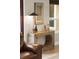 Close-up of a stylish end table and lamp next to leather sofa providing an accent feature in the living room area at 4048 Gilder Rose Pl, Winter Park, FL 32792