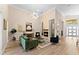 Spacious living room with fireplace, modern lighting, neutral paint, hardwood floors, and an open-concept design at 4048 Gilder Rose Pl, Winter Park, FL 32792