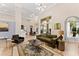 Open living room with high ceilings, hardwood floors, and large windows, perfect for entertaining at 4048 Gilder Rose Pl, Winter Park, FL 32792