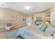 Bright main bedroom featuring a ceiling fan, decorative rug, and closet with mirrored doors that enhance the space at 4048 Gilder Rose Pl, Winter Park, FL 32792