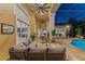 The screened patio features an entertainment area with a pool view and comfortable seating at 4048 Gilder Rose Pl, Winter Park, FL 32792