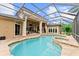 Backyard pool with spa, stone patio, and screened enclosure offer an outdoor oasis at 4048 Gilder Rose Pl, Winter Park, FL 32792