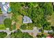 Bird's eye view of a single Gathering home with a pool, lush landscaping, and a private driveway at 408 W Pearl St, Minneola, FL 34715