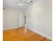 Large bedroom with wooden floors and a textured ceiling at 408 W Pearl St, Minneola, FL 34715