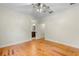Large bedroom with hardwood floors and view to ensuite bathroom at 408 W Pearl St, Minneola, FL 34715