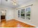 Bright bedroom featuring large windows with backyard views and an ensuite bathroom at 408 W Pearl St, Minneola, FL 34715