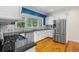 Kitchen featuring stainless steel appliances, granite countertops, and crisp white cabinetry at 408 W Pearl St, Minneola, FL 34715