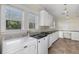 Laundry area featuring a washer, dryer, sink, and ample counter space with bright light at 408 W Pearl St, Minneola, FL 34715