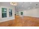 Bright living room with hardwood floors and a fireplace, creating a warm and inviting atmosphere at 408 W Pearl St, Minneola, FL 34715