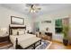 Spacious main bedroom features hardwood floors, a ceiling fan, and plenty of natural light at 408 W Pearl St, Minneola, FL 34715