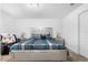 Cozy main bedroom with a decorative bed frame, carpet flooring and ample natural light at 411 Ridges Dr, Dundee, FL 33838