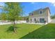 A spacious backyard features a well-maintained lawn and privacy fence at 4432 Desert Rose Ave, Kissimmee, FL 34746