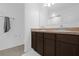 Bathroom with a double sink vanity, neutral countertop, and chrome fixtures, offering a clean and functional space at 4432 Desert Rose Ave, Kissimmee, FL 34746