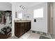 Bathroom featuring a double sink vanity, tiled floors and a glass enclosed shower at 4432 Desert Rose Ave, Kissimmee, FL 34746