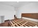 Empty bedroom with wood floors, a bed frame and bright light at 4432 Desert Rose Ave, Kissimmee, FL 34746