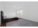 Bedroom featuring a bed, decorative rug, and a modern recessed light at 4432 Desert Rose Ave, Kissimmee, FL 34746