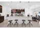Stylish kitchen with granite countertops, stainless steel appliances, pendant lighting, and a breakfast bar with seating at 4432 Desert Rose Ave, Kissimmee, FL 34746