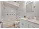 Bathroom featuring tub, shower and vanity with white cabinets at 463 Warrenton Rd # 463, Winter Park, FL 32792