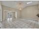 Spacious living room area featuring vaulted ceilings and tile flooring at 463 Warrenton Rd # 463, Winter Park, FL 32792