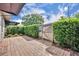 Outdoor patio featuring a brick paver, lush landscaping, and privacy fence at 463 Warrenton Rd # 463, Winter Park, FL 32792