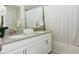 Modern bathroom with a double vanity, white cabinets, tub and shower at 4912 Windermere Ave, Kissimmee, FL 34746