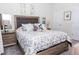 Comfortable bedroom features a decorative headboard and a side table with lamps at 4912 Windermere Ave, Kissimmee, FL 34746