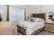 This bedroom features a comfortable bed, side tables with lamps, and a window at 4912 Windermere Ave, Kissimmee, FL 34746