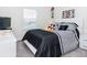 Bright bedroom features a white dresser, TV, and Mickey Mouse decor at 4912 Windermere Ave, Kissimmee, FL 34746