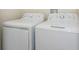 Clean laundry area with a side-by-side washer and dryer unit at 4912 Windermere Ave, Kissimmee, FL 34746