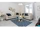 Chic living room with neutral tones, designer furniture, and stylish decor, offering a comfortable and elegant space to relax at 4912 Windermere Ave, Kissimmee, FL 34746