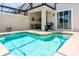 Beautiful outdoor pool area with patio seating and a covered patio at 4912 Windermere Ave, Kissimmee, FL 34746