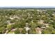 This is an aerial view of the neighborhood, full of mature trees and well-maintained homes at 5177 Chesapeake Ave, Orlando, FL 32808