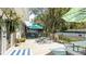 Spacious backyard deck with outdoor seating, a dining area, and lush landscaping, perfect for enjoying the outdoors at 5177 Chesapeake Ave, Orlando, FL 32808