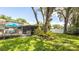 This spacious backyard features a deck and screened in patio, perfect for Gathering and guests at 5177 Chesapeake Ave, Orlando, FL 32808