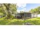 Large screened-in back patio with access to backyard, a great space for entertaining at 5177 Chesapeake Ave, Orlando, FL 32808