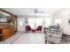 Bright living room with tile floors, decorative furniture, and a wood accent wall that brings warmth to the space at 5177 Chesapeake Ave, Orlando, FL 32808