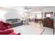 Open-concept living space with tile flooring, a neutral color scheme, and ample room for dining and entertaining at 5177 Chesapeake Ave, Orlando, FL 32808