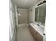 Bright bathroom featuring a shower-tub combination, toilet, and a single vanity at 5459 Vineland Rd # 4310, Orlando, FL 32811