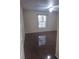 Bedroom with hardwood floors and a bright window bringing in natural light at 5459 Vineland Rd # 4310, Orlando, FL 32811