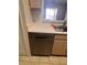 Modern stainless steel dishwasher installed next to the sink and wooden cabinets at 5459 Vineland Rd # 4310, Orlando, FL 32811