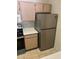Efficient kitchen setup featuring stainless steel refrigerator and modern electric stove at 5459 Vineland Rd # 4310, Orlando, FL 32811