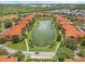Aerial view of community with lake and lush landscaping at 5512 Metrowest Blvd # 201, Orlando, FL 32811