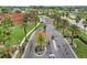 Aerial view showcasing gated entrance, mature palms and surrounding community at 5512 Metrowest Blvd # 201, Orlando, FL 32811