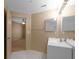 Neutral toned bathroom with double vanity and tiled floors at 5512 Metrowest Blvd # 201, Orlando, FL 32811