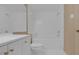 Bathroom featuring a bathtub and tiled walls at 5512 Metrowest Blvd # 201, Orlando, FL 32811