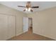Bright bedroom with wood floors, ceiling fan, and spacious closet at 5512 Metrowest Blvd # 201, Orlando, FL 32811