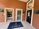 Community center entrance with The Palms Club mat and access to the fitness center and other amenities at 5512 Metrowest Blvd # 201, Orlando, FL 32811