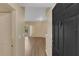 Inviting entryway leading to a well-lit living space with modern flooring, offering a warm welcome to the home at 5512 Metrowest Blvd # 201, Orlando, FL 32811