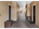 Hallway with entrances to apartments at 5512 Metrowest Blvd # 201, Orlando, FL 32811